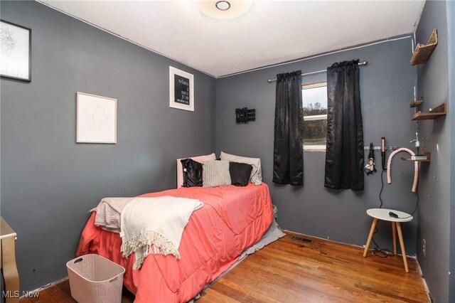 bedroom featuring hardwood / wood-style floors