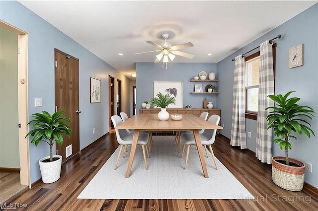 5057 Buchanan Rd, Waterford, OH 45786 - dining area featuring a ceiling fan, dark wood-type flooring, baseboards, and visible vents