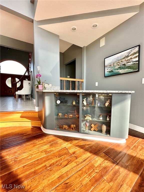 bar featuring hardwood / wood-style floors