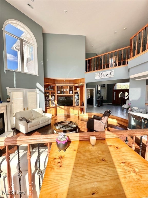 living room featuring a towering ceiling