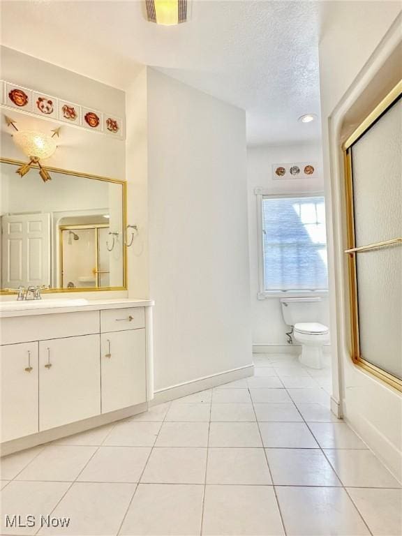282 Orlando Mnr, Wintersville, OH 43953 - full bathroom featuring toilet, a shower with shower door, vanity, tile patterned floors, and a textured ceiling