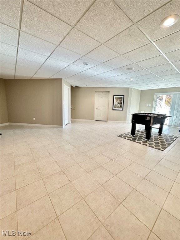 basement featuring a paneled ceiling