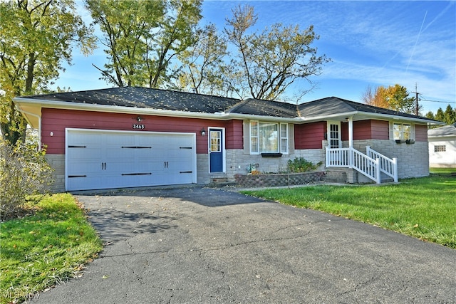 ranch-style house with a front yard and a garage