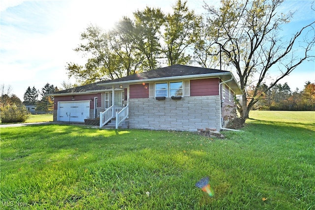 single story home with a front yard and a garage