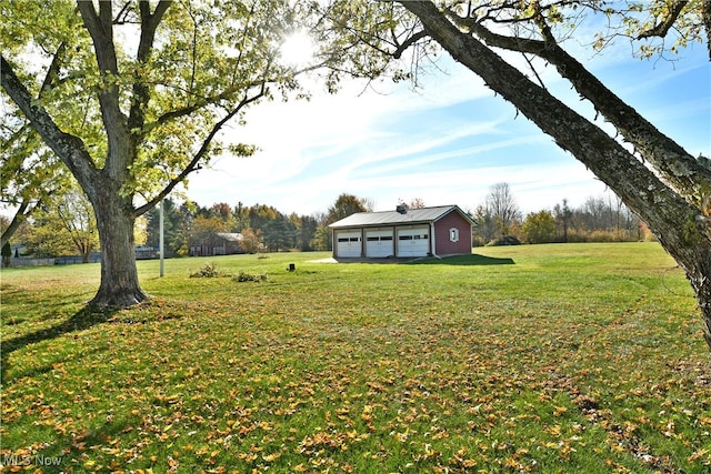 view of yard with a garage