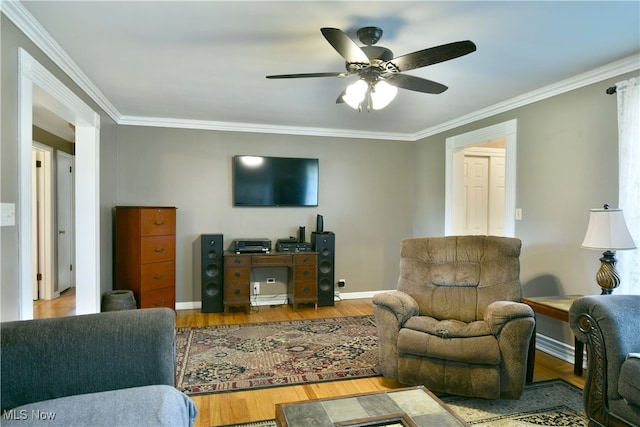 living room with ceiling fan, crown molding, and hardwood / wood-style floors