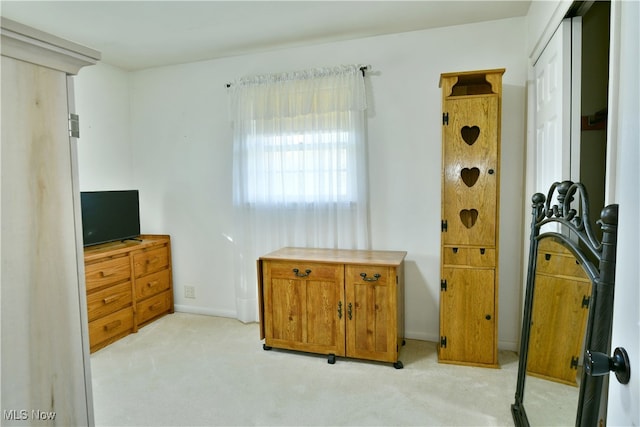 bedroom with light colored carpet