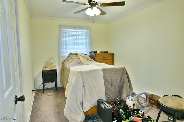 bedroom featuring ceiling fan, carpet flooring, and ornamental molding