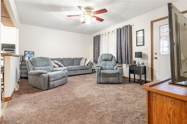 carpeted living room featuring ceiling fan