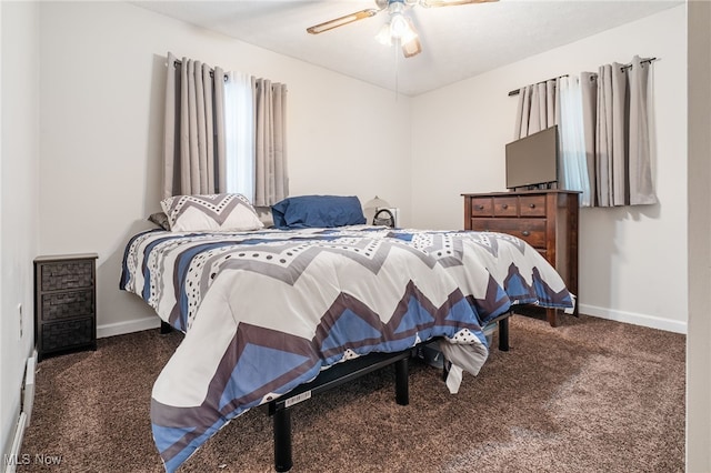 bedroom featuring ceiling fan and dark carpet