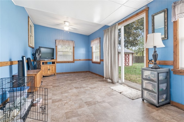 interior space with a healthy amount of sunlight and ceiling fan