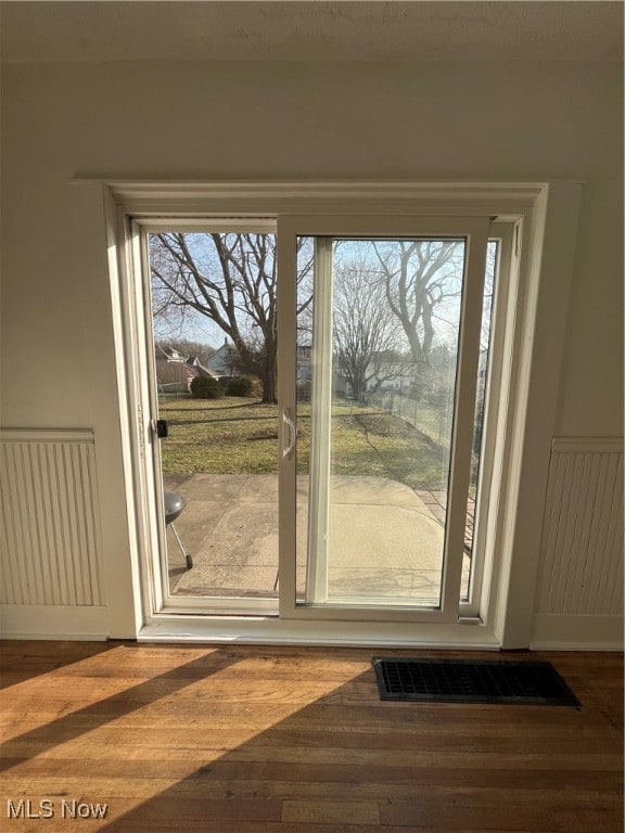 doorway to outside featuring hardwood / wood-style floors and a wealth of natural light