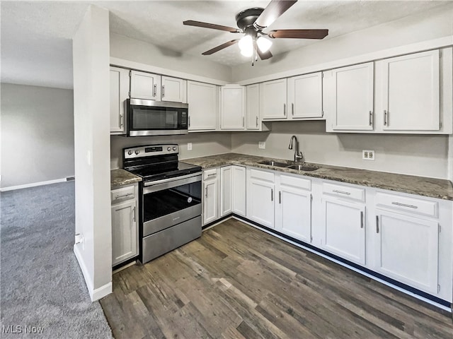 kitchen featuring white cabinets, stainless steel appliances, and sink