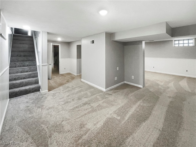 basement featuring carpet flooring