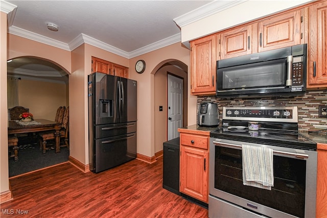 kitchen featuring dark wood-type flooring, stainless steel range with electric stovetop, decorative backsplash, and fridge with ice dispenser