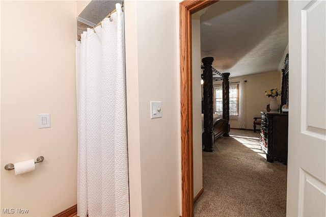 hallway with carpet flooring