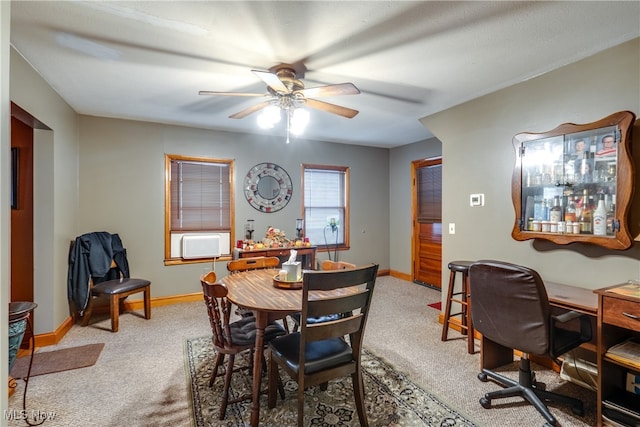 dining space featuring ceiling fan and carpet floors