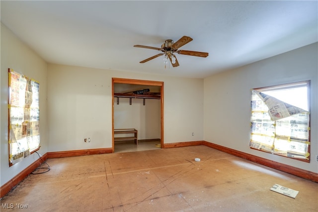 unfurnished bedroom featuring multiple windows, a closet, and ceiling fan