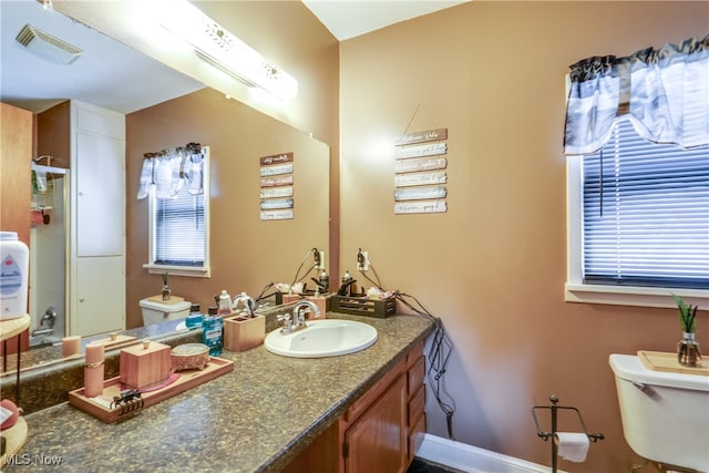 bathroom with vanity and toilet