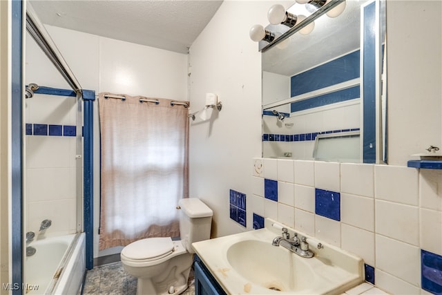 full bathroom with bathtub / shower combination, tasteful backsplash, a textured ceiling, toilet, and vanity