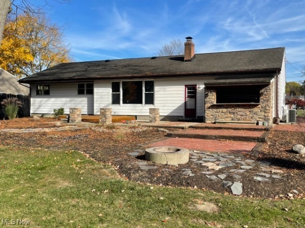 back of property featuring cooling unit