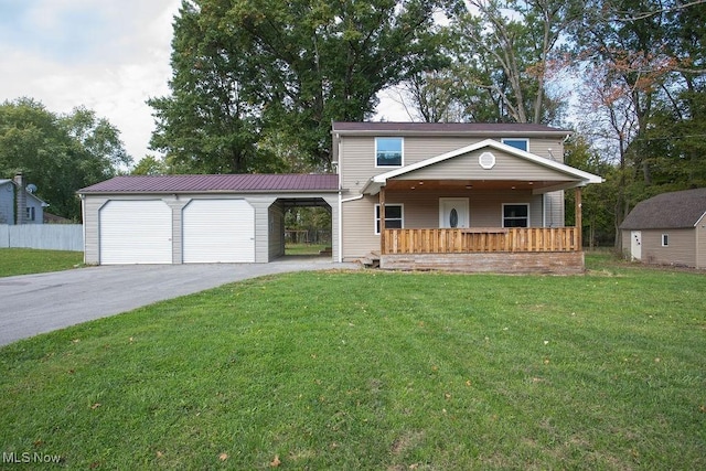 view of property featuring a carport, a garage, covered porch, and a front lawn