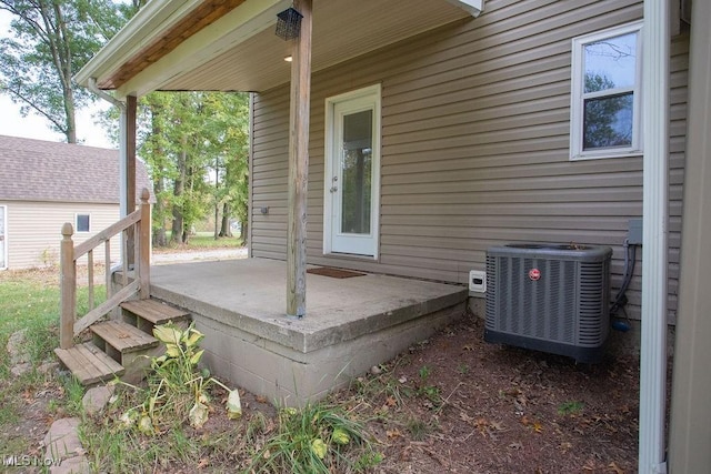 deck with central AC unit and a patio area