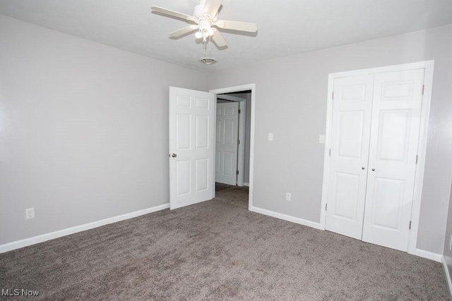 unfurnished bedroom with ceiling fan, a closet, and carpet