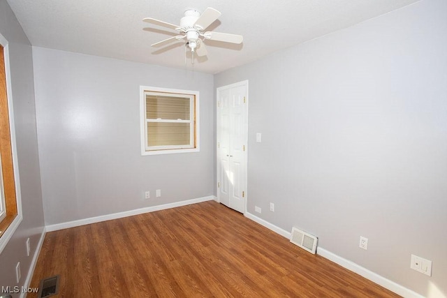 unfurnished room featuring hardwood / wood-style floors and ceiling fan