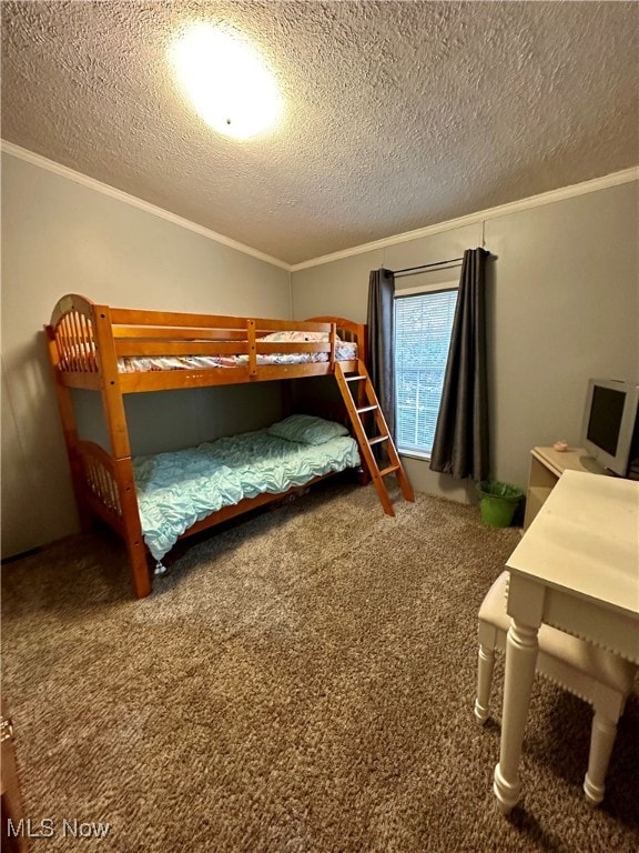 carpeted bedroom featuring crown molding and a textured ceiling