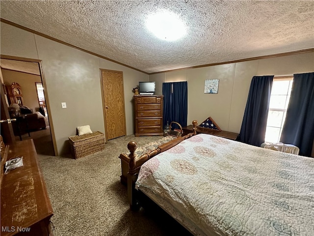 bedroom featuring carpet flooring, a textured ceiling, lofted ceiling, and ornamental molding