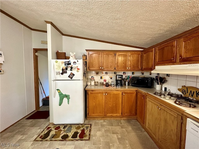 kitchen with white appliances, backsplash, a textured ceiling, and lofted ceiling