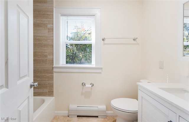 bathroom with baseboard heating, vanity, and toilet