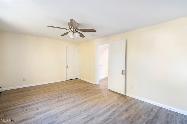 empty room with light hardwood / wood-style flooring and ceiling fan