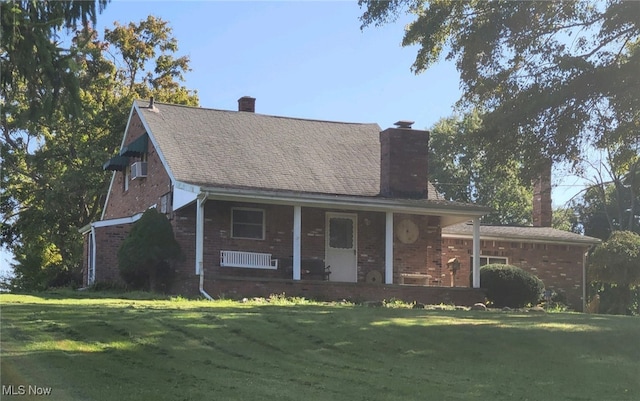 view of front of property with a porch and a front yard