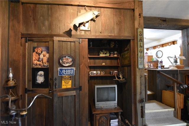 bar featuring wood walls