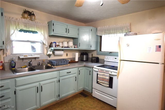 kitchen with white appliances and sink