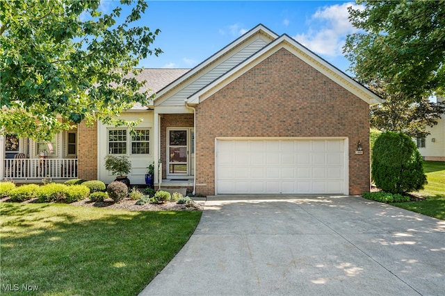 view of front of property featuring a front lawn and a garage