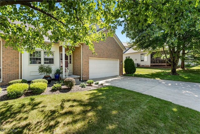 view of front of home featuring a front lawn and a garage