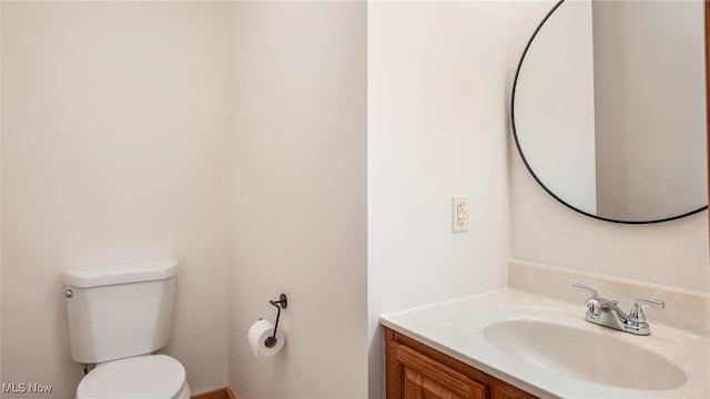 bathroom with toilet and vanity