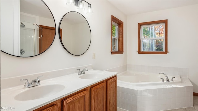 bathroom featuring vanity, independent shower and bath, and tile patterned flooring