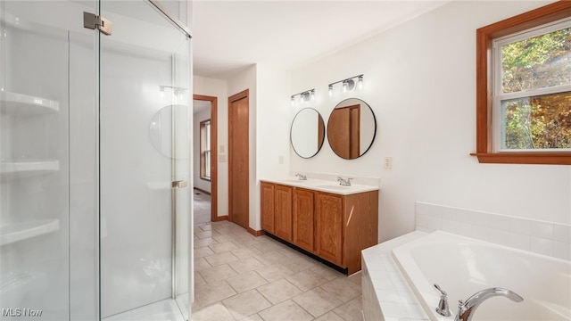 bathroom featuring vanity and separate shower and tub