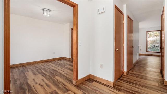 hallway with wood-type flooring