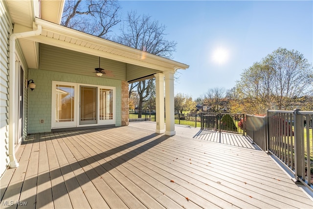 wooden terrace featuring ceiling fan