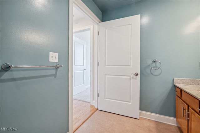 bathroom featuring vanity and hardwood / wood-style floors