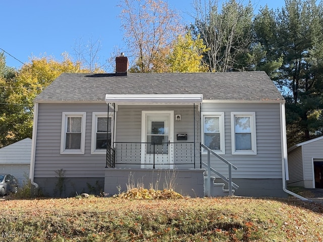 view of front facade featuring a porch and a garage