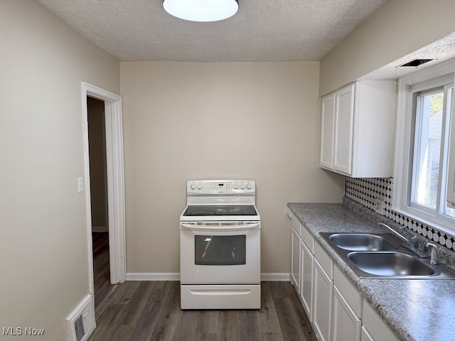 kitchen featuring sink, a textured ceiling, white cabinets, white electric range oven, and dark hardwood / wood-style floors