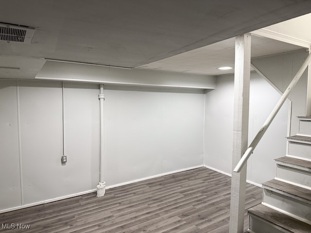 basement with hardwood / wood-style floors