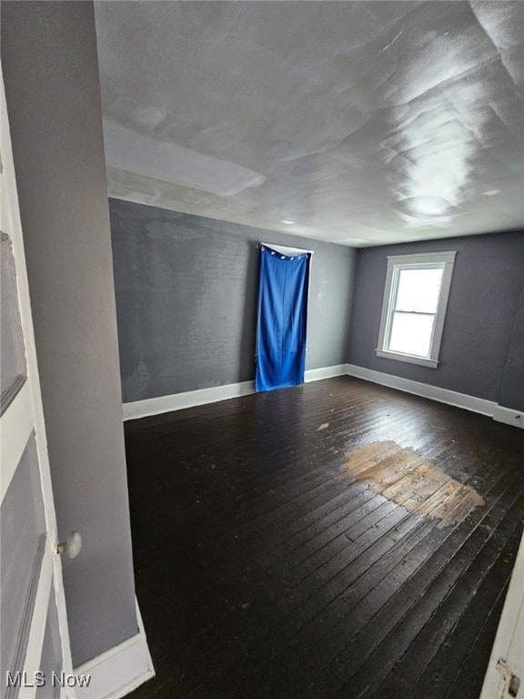 spare room featuring hardwood / wood-style flooring