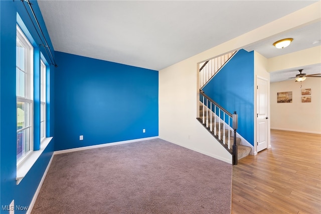 spare room featuring hardwood / wood-style flooring and ceiling fan